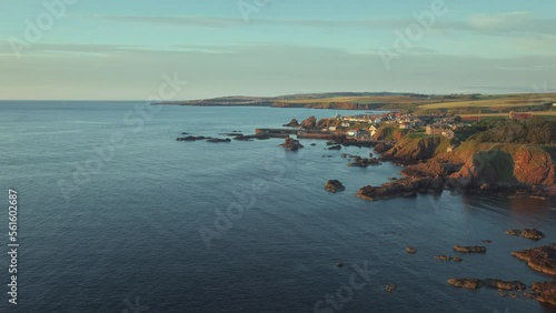 The south east coast of Scotland lit up by the morning sunshine. Video with the panning camera motion. Village of St. Abbs, Starney Bay - Nature Reserve, Berwickshire, Scotland, UK  photo