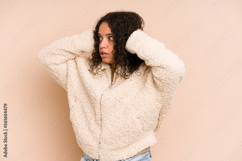 Young african american curly woman isolated screaming, very excited, passionate, satisfied with something. Young african american curly woman isolated screaming, very excited, passionate, satisfied with something.