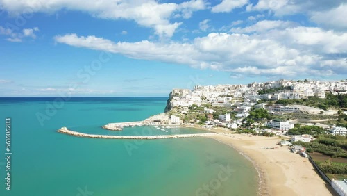 The beach and town of Peschici in Europe, Italy, Puglia, towards Foggia, in summer, on a sunny day. photo