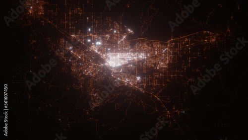 Grand Junction (Colorado, USA) aerial view at night. Satellite view on modern city with street lights. Camera is flying above the city, moving forward photo