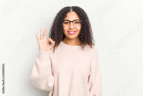 Young african american woman isolated on white background cheerful and confident showing ok gesture.