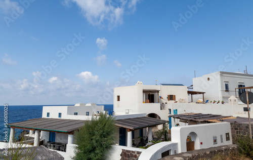 Stromboli Island - Traditional White Houses with Blue Sky and Lava Rock Landscape