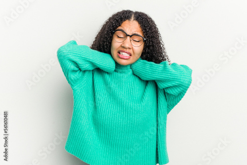 Young african american woman isolated on white background suffering neck pain due to sedentary lifestyle. © Asier