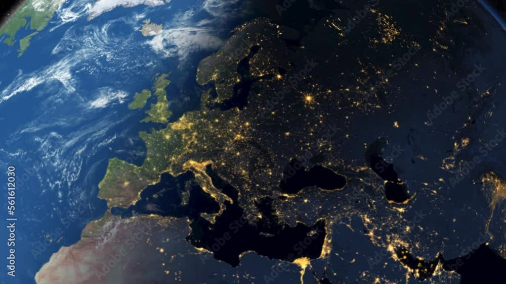 Realistic Earth rotating.Day to night transition as seen from space. Glowing bright city lights shine at European continent.