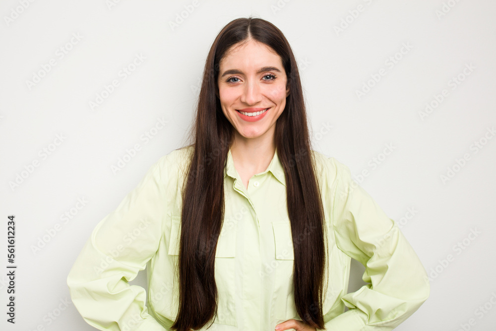 Young caucasian woman isolated on white background confident keeping hands on hips. Young caucasian woman isolated on white background confident keeping hands on hips.