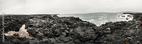 Brimketill lava rock pool - natural pool at the bottom of the cliffs, located on the Reykjanes Peninsula, west of the Grindavik, Iceland. photo