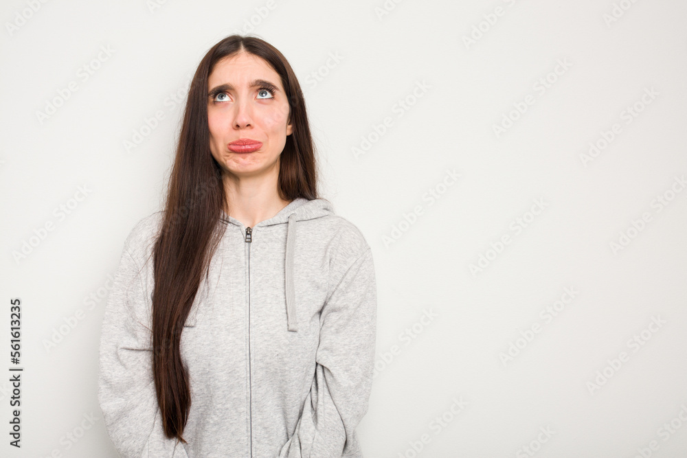 Young caucasian woman isolated on white background shouting very angry, rage concept, frustrated. Young caucasian woman isolated on white background shouting very angry, rage concept, frustrated.