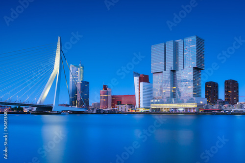 Rotterdam  Holland. View of the Erasmus Bridge and the city center. Panoramic view. Cityscape in the evening. Skyscrapers and buildings.
