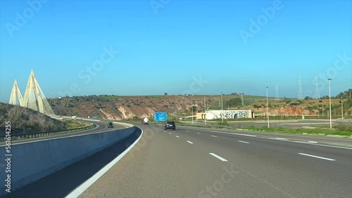 Dashcam view of a car driving Through the Mohammed VI bridge on the highway in Morocco