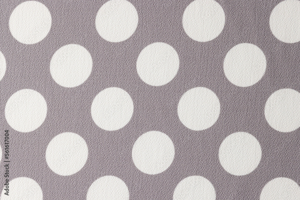 Gray and white fabric with polka dot pattern.