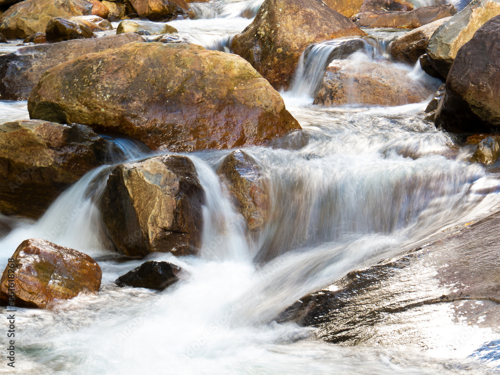 Beautiful waterfall with blurred crystalline waters photographed in long exposure Beautiful waterfall with blurred crystalline waters photographed in long exposure