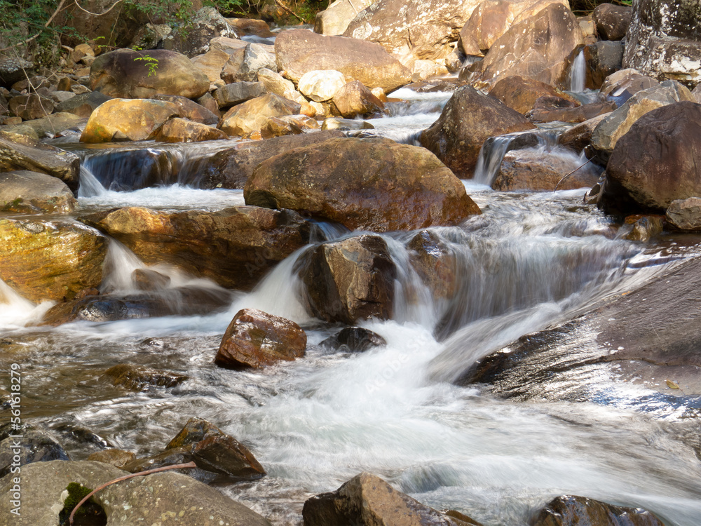 Beautiful waterfall with blurred crystalline waters photographed in long exposure Beautiful waterfall with blurred crystalline waters photographed in long exposure