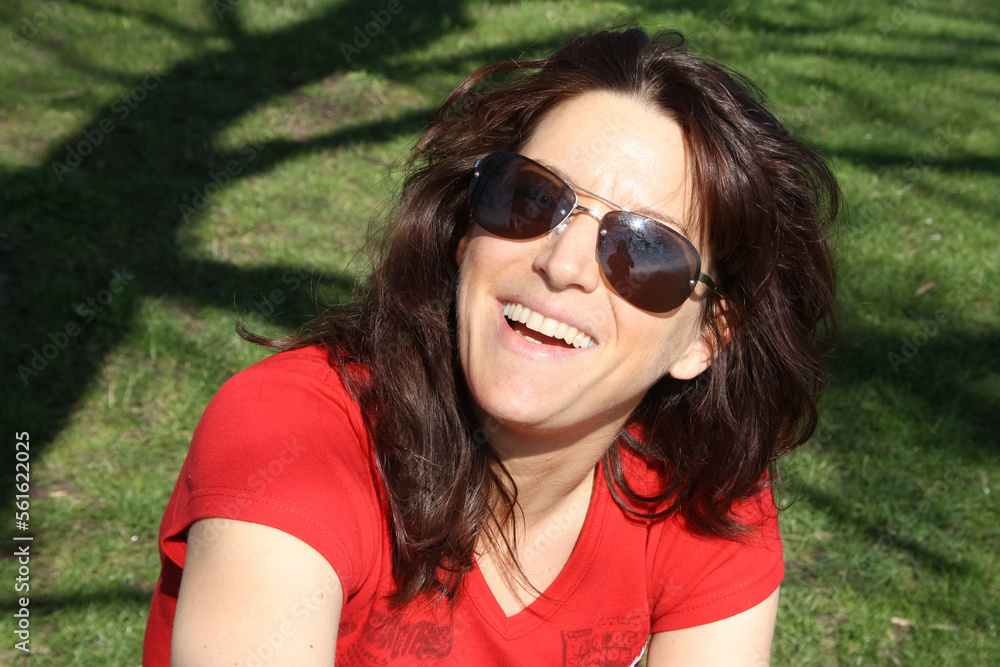 woman in red shirt laug heartly woman in red shirt laug heartly