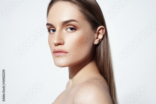 Beautiful caucasian girl with perfect skin and natural makeup on white background