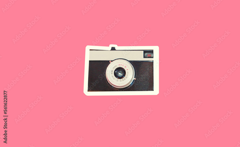 Close up of vintage film camera on pink background, top view, magazine style