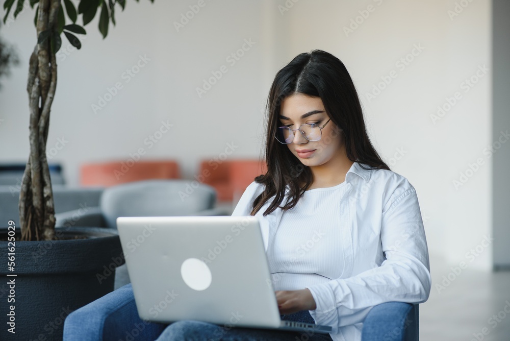 Hipster Girl use Laptop huge Loft Studio.Student Researching Process Work.Young Business Woman Working Creative Startup modern Office.Analyze market stock,new strategy Hipster Girl use Laptop huge Loft Studio.Student Researching Process Work.Young Business Woman Working Creative Startup modern Office.Analyze market stock,new strategy