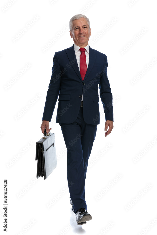 businessman going to work relaxed and a briefcase in hand businessman going to work relaxed and a briefcase in hand