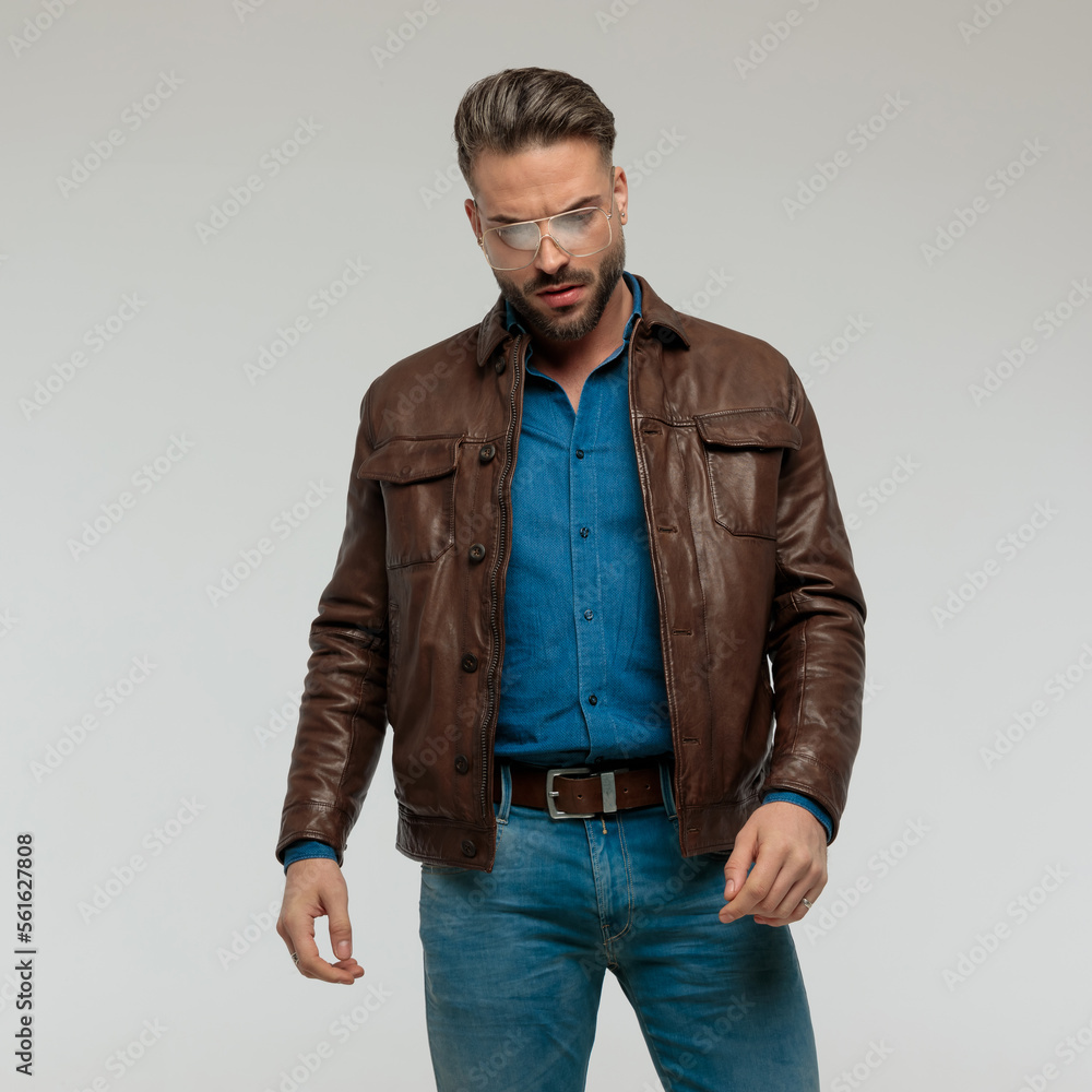 casual man looking down with dramatic pose casual man looking down with dramatic pose