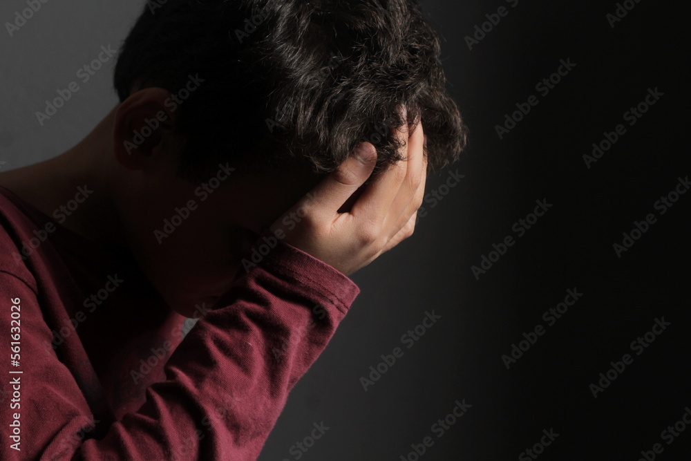 child praying to God with hands together with black background with people stock photo child praying to God with hands together with black background with people stock photo