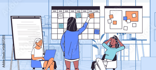businesswomen team scheduling work agenda on weekly meeting schedule task board girls discussing during meeting