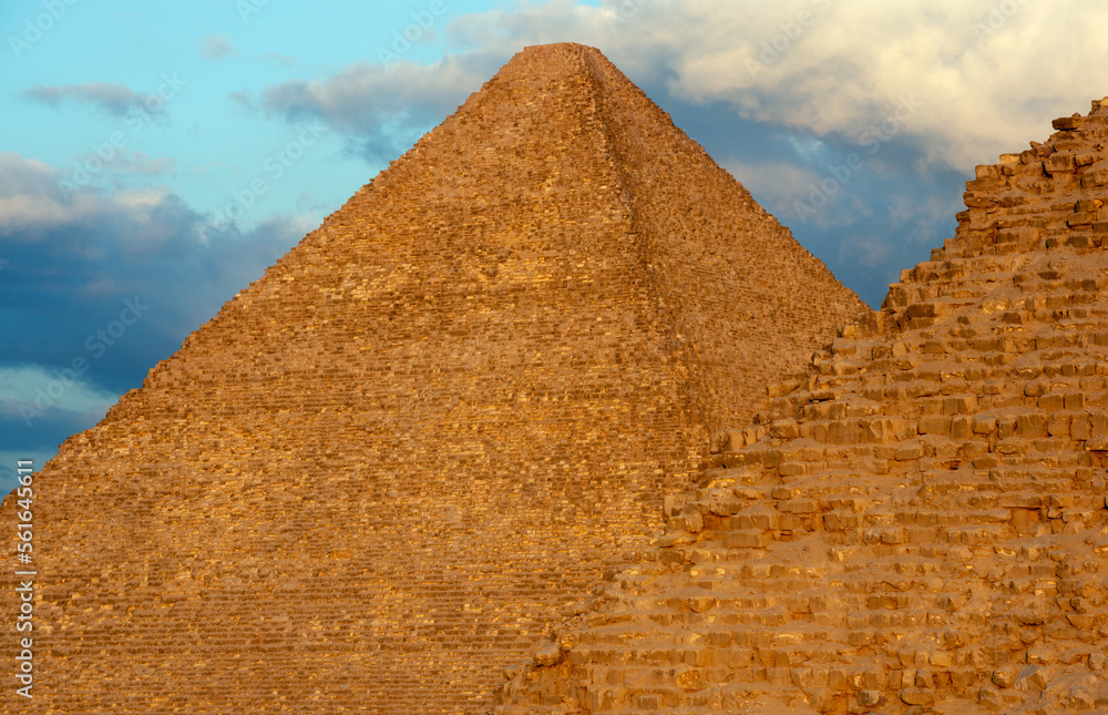 Part of pyramid of Khafre or of Chephren and Great Pyramid of Giza, pyramid of Khufu or Cheops behind in evening light Part of pyramid of Khafre or of Chephren and Great Pyramid of Giza, pyramid of Khufu or Cheops behind in evening light