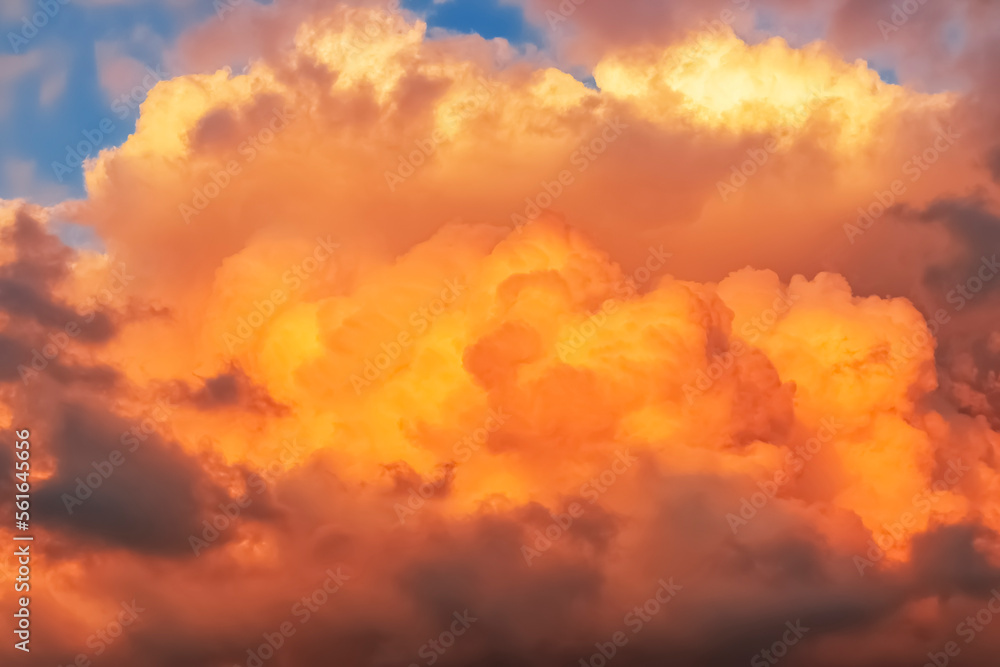 fiery orange clouds , surreal color of the sky