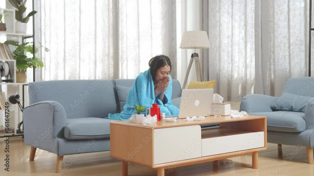 Asian Woman With Blanket Trying To Get Warm While Sitting On Sofa Works On A Laptop Computer In The Living Room At Home
Asian Woman With Blanket Trying To Get Warm While Sitting On Sofa Works On A Laptop Computer In The Living Room At Home