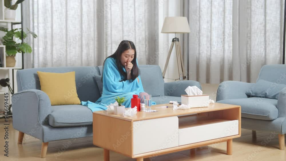 Sick Asian Woman With Blanket Suffering From Cough On Sofa In The Living Room At Home
Sick Asian Woman With Blanket Suffering From Cough On Sofa In The Living Room At Home