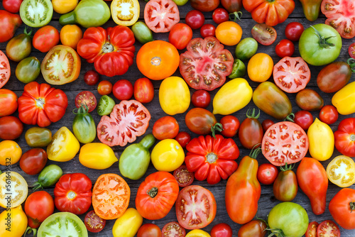 colorful tomatoes on the wooden background