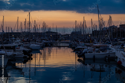 sunset in the port of Alicante, Spain with yachts