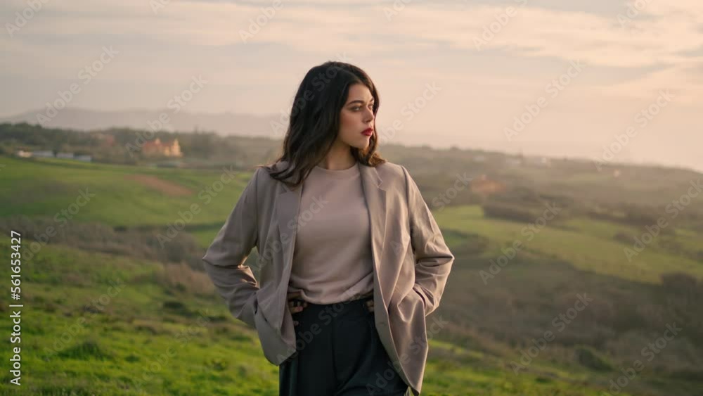 Gorgeous woman walking hill closeup. Attractive girl looking on cloudy scenery. Gorgeous woman walking hill closeup. Attractive girl looking on cloudy scenery.