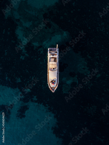 aerial drone view of a luxury yacht sailing on open water, showcasing the ultimate in luxury © Uldis Laganovskis