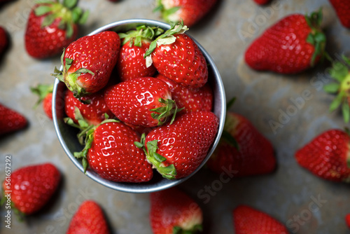 Overhead view of strawberries in bowl on table