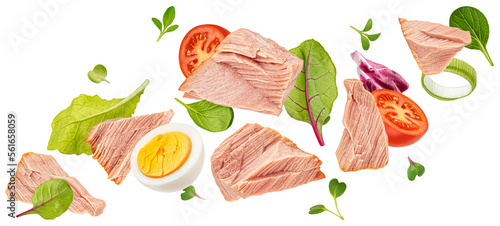 Foto Falling tuna salad isolated on white background