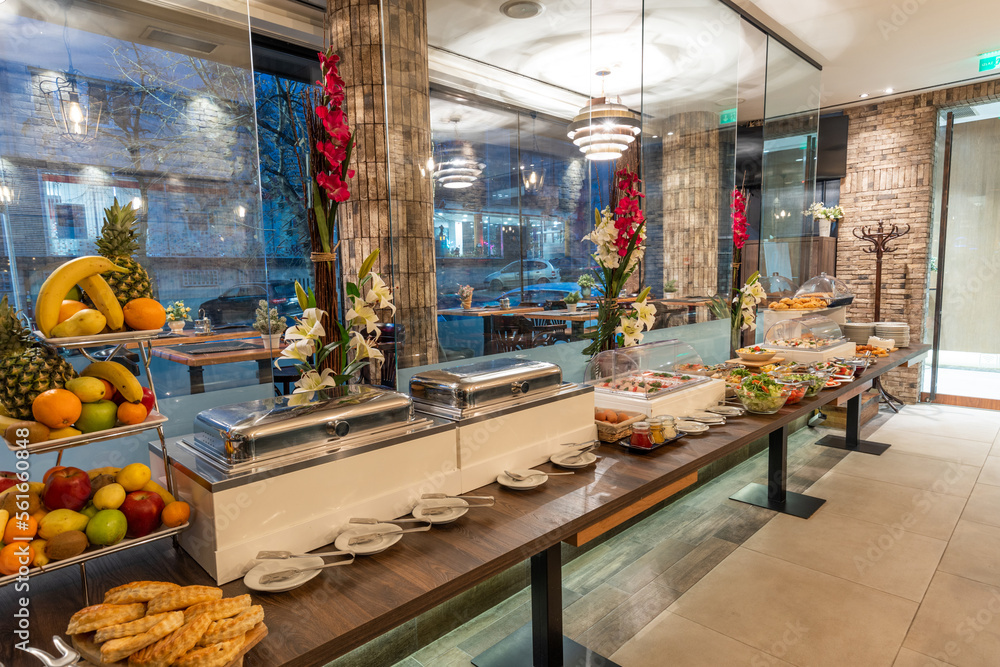 Restaurant interior with food buffet table