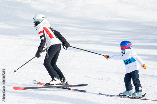 People are having fun in downhill skiing and snowboarding	