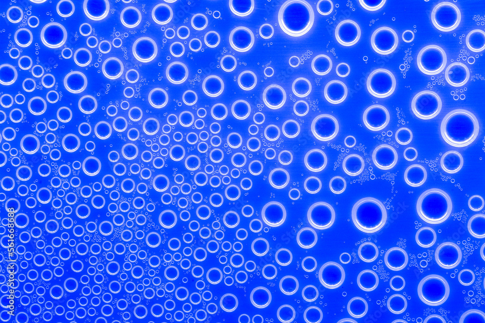 Bubbles blue background.Indigo pattern with white circles. Macro round bubbles texture in blue tones.beautiful Indigo background with circles.macro Bubbles set. 