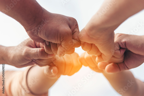 Close up hands Teamwork group of multi racial people meeting join hands. Diversity people hands join empower partnership teams connect volunteer community. Diverse multiethnic Partners team together photo