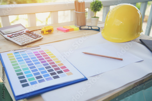 construction engineer office desk architect workplace. engineer drawing objects table with meter, blueprint, hard hat engineering stuff on desk. Designer Objects drafting workplace on wooden table.