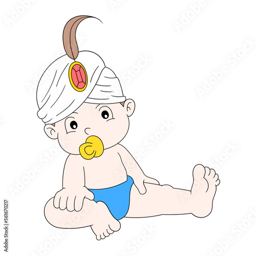 cute baby boy sitting sucking on a pacifier