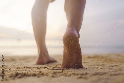 Men's footsteps on the beach 