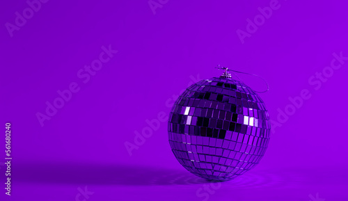 Disco ball on a blurred purple background  the concept of dancing  disco  music and parties  copy space.