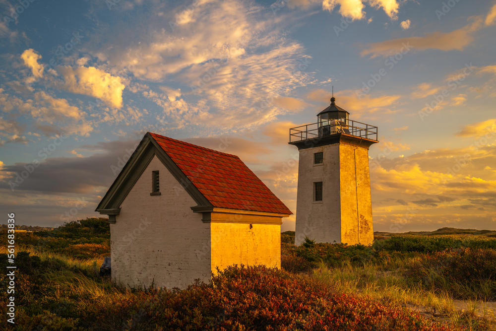 Wood End Lighthouse in Provincetown on Cape Cod, Massachusetts, USA, oceanside beach seascape at golden sunset Wood End Lighthouse in Provincetown on Cape Cod, Massachusetts, USA, oceanside beach seascape at golden sunset