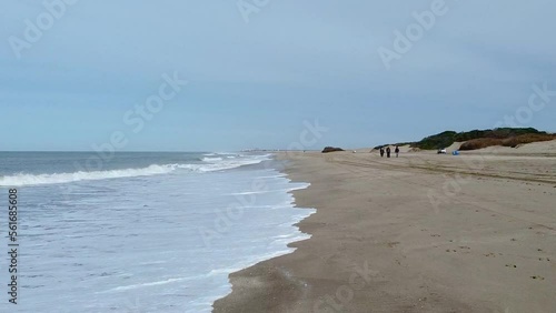 Quiet morning by the sea shore on a wide open beach with an astonishing blue sky. Cariló, Argentina photo