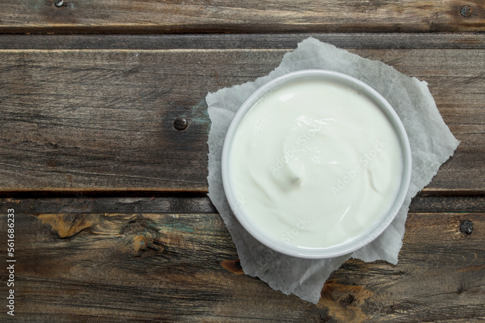 Fresh sour cream in bowl . Fresh sour cream in bowl .