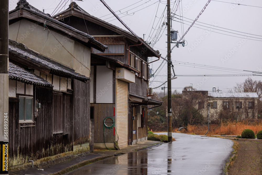 Old wooden Japanese house in rural village on a rainy day