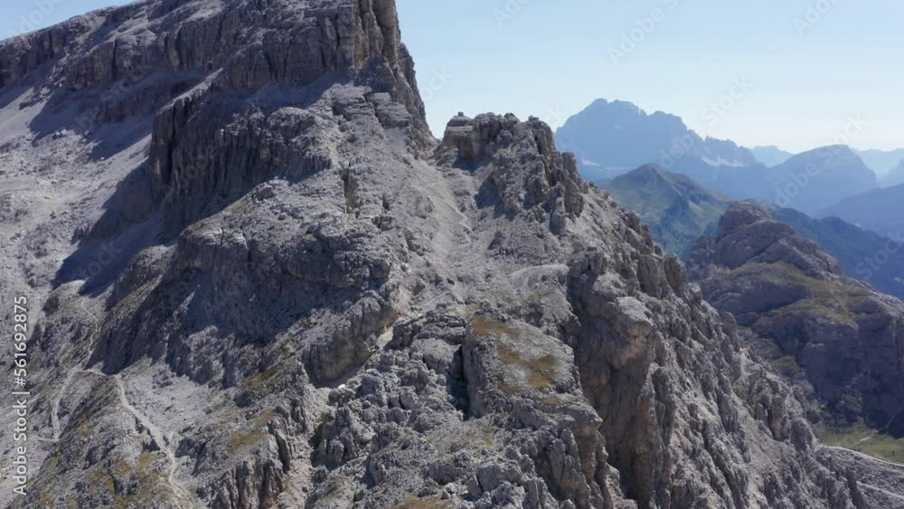 Aerial moving towards Dolomite mountains in Val Badia Valley with blue skies. Italy Aerial moving towards Dolomite mountains in Val Badia Valley with blue skies. Italy