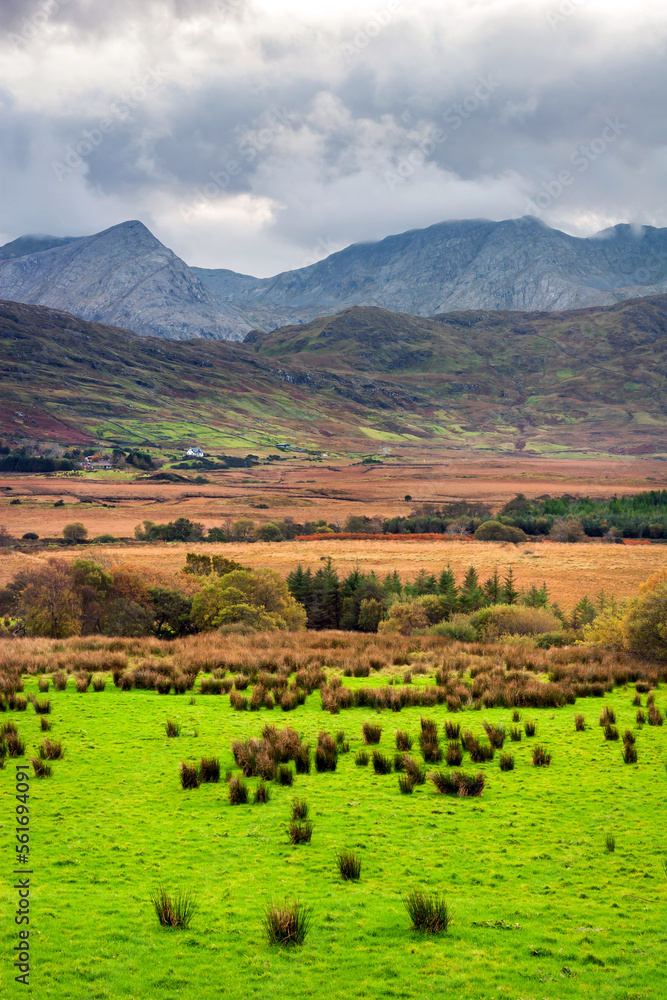 Scenic landscape with green fields in the Connemara mountains