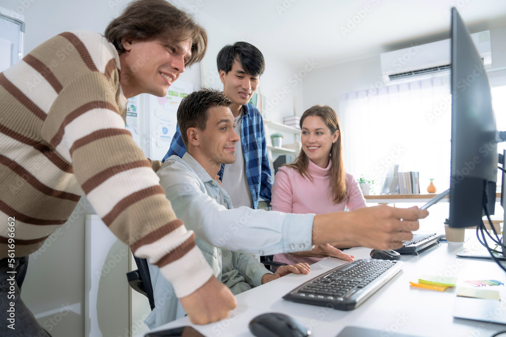 Group of employees brainstorming and teamwork in office.