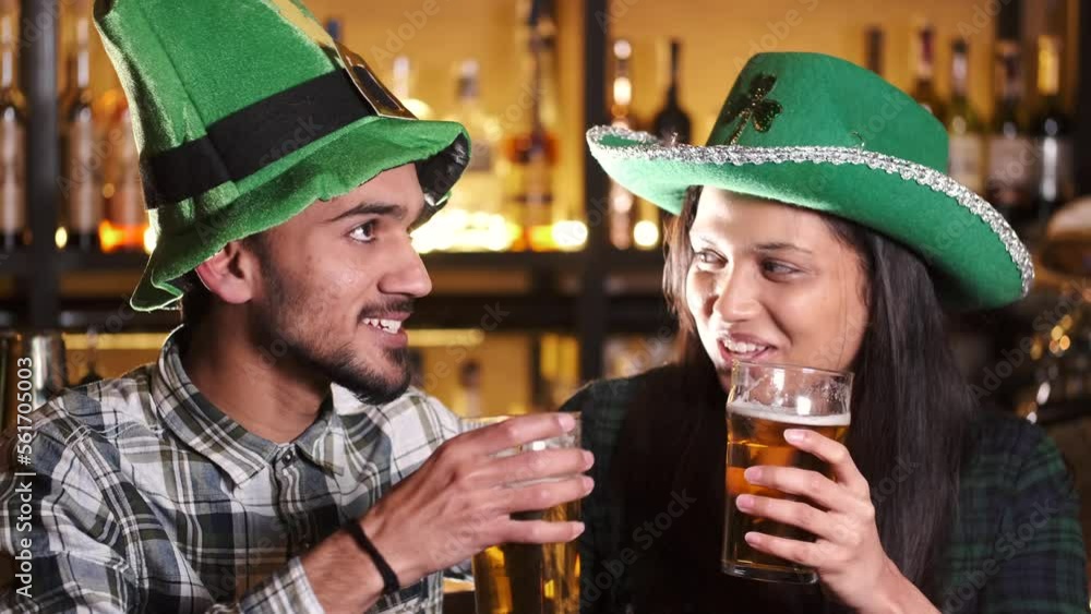Indian friends celebrating a Saint Patrick's Day at pub Indian friends celebrating a Saint Patrick's Day at pub